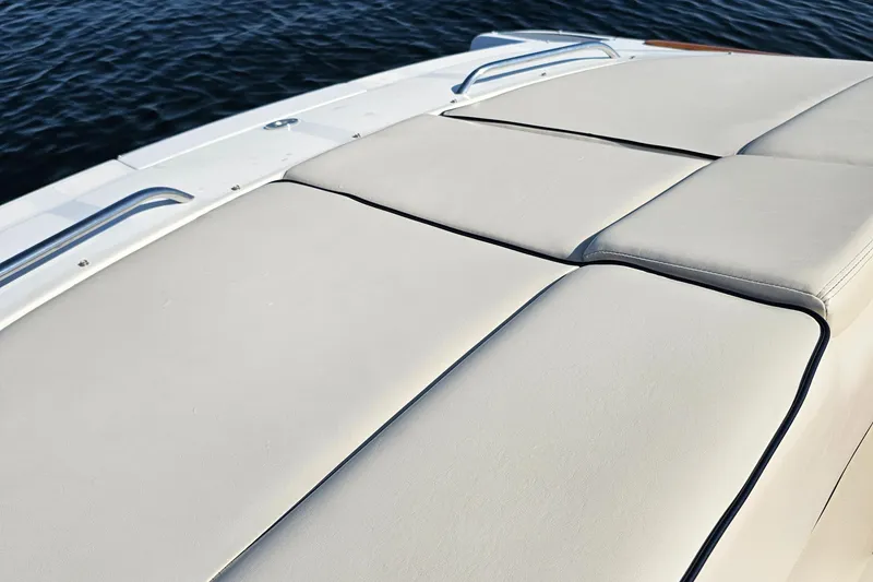 Slide: The Image of 2006 Chris-Craft Corsair 28 boat with beige cushioned seating on deck. - 62