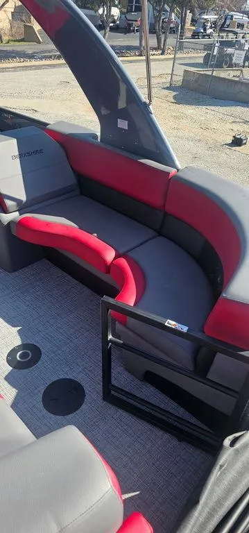 Slide: The Image of 2023 Berkshire 25RFX STS 3.0 boat interior with red and gray seating. - 11