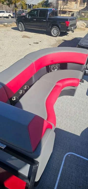 Slide: The Image of 2023 Berkshire 25RFX STS 3.0 boat interior with red and gray seating. - 12