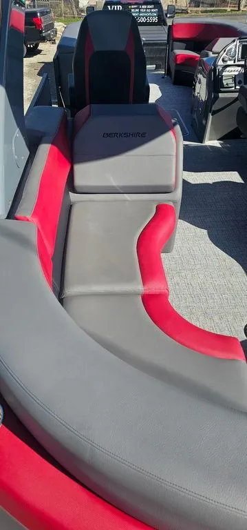 Slide: The Image of 2023 Berkshire 25RFX STS 3.0 boat interior with red and gray seating. - 16
