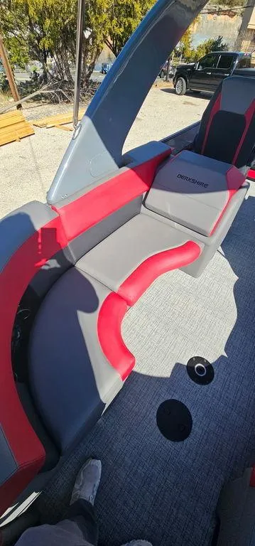 Slide: The Image of 2023 Berkshire 25RFX STS 3.0 boat interior with red and gray seating. - 17
