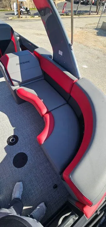 Slide: The Image of 2023 Berkshire 25RFX STS 3.0 boat interior with red and gray seating. - 18