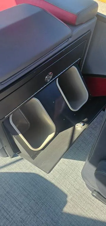 Slide: The Image of 2023 Berkshire 25RFX STS 3.0 interior storage compartments with red and black seating. - 19
