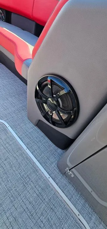 Slide: The Image of 2023 Berkshire 25RFX STS 3.0 interior with speaker and red seating. - 23