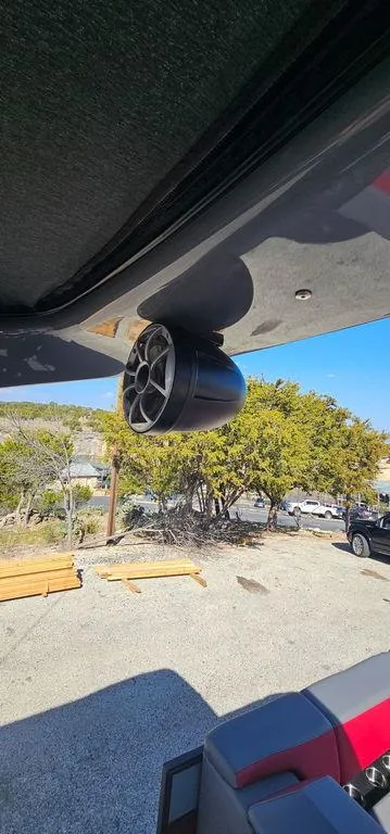 Slide: The Image of 2023 Berkshire 25RFX STS 3.0 boat speaker, outdoor setting, sunny day. - 25