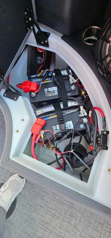 Slide: The Image of Battery compartment of 2023 Berkshire 25RFX STS 3.0 boat, showing wiring and connections. - 26
