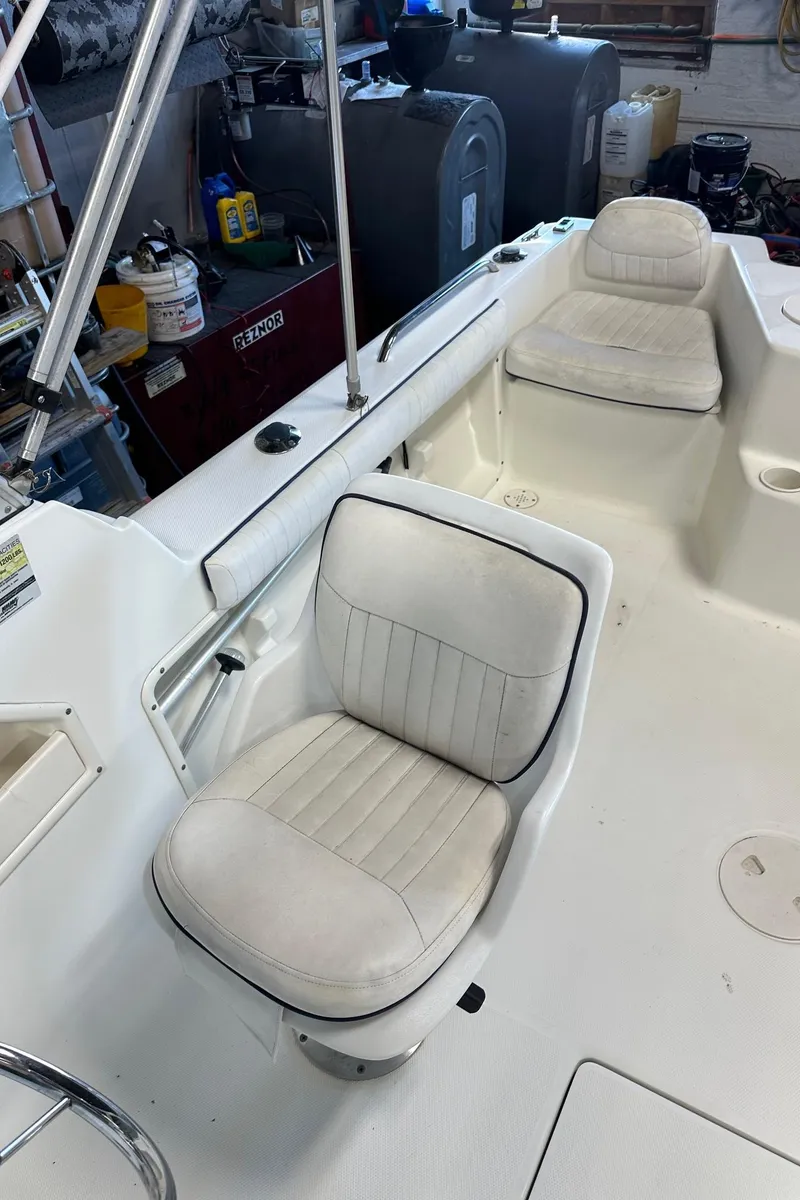Slide: The Image of 2006 Hydra-Sports Lightning 202 DC boat interior with white cushioned seats. - 10