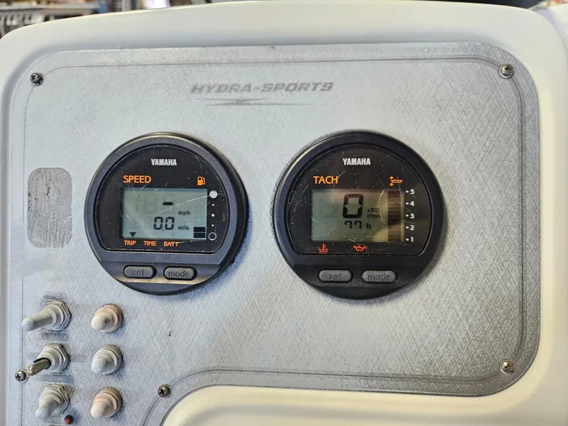 Slide: The Image of 2006 Hydra-Sports Lightning 202 DC dashboard with Yamaha speed and tachometer gauges. - 14