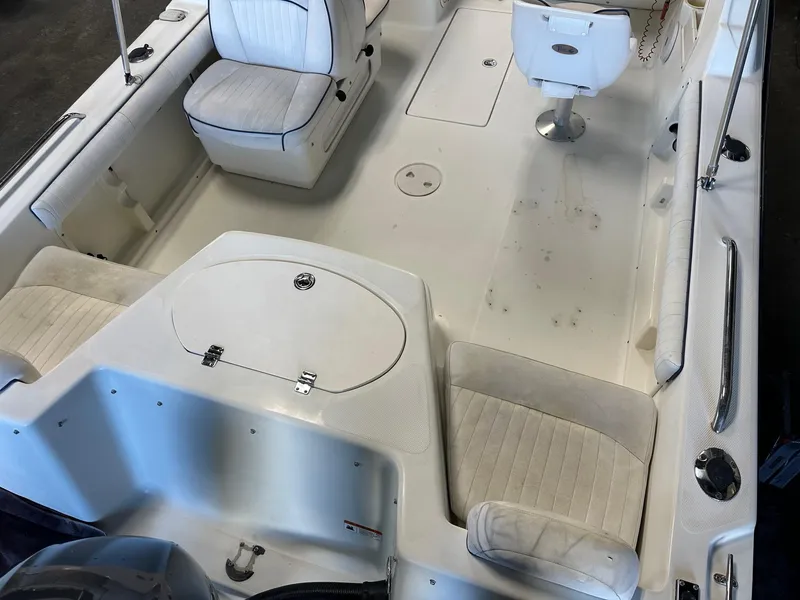 Slide: The Image of 2006 Hydra-Sports Lightning 202 DC boat interior with white seating and storage compartments. - 3