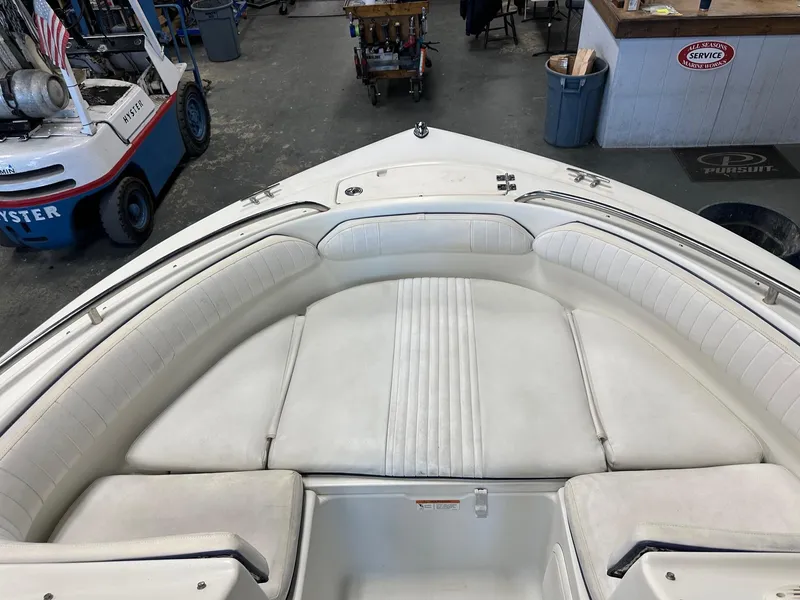 Slide: The Image of 2006 Hydra-Sports Lightning 202 DC boat interior with white cushioned seating. - 4