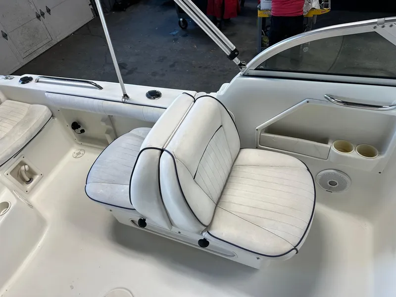 Slide: The Image of 2006 Hydra-Sports Lightning 202 DC boat interior with white seating and cup holders. - 5