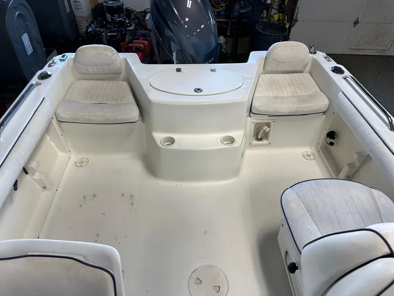 Slide: The Image of 2006 Hydra-Sports Lightning 202 DC boat interior with seating and storage compartments. - 6