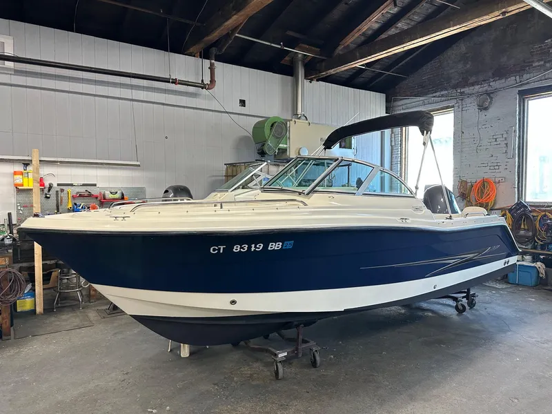 Slide: The Image of 2006 Hydra-Sports Lightning 202 DC boat in a garage setting. - 7