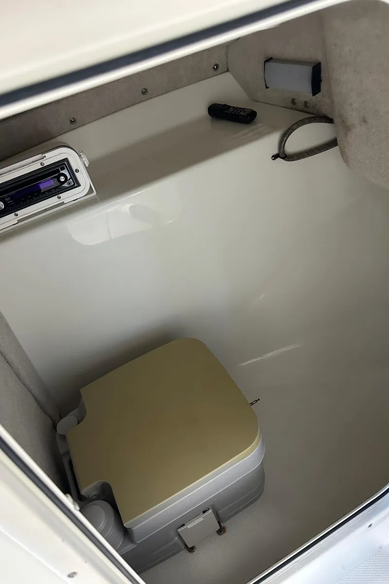 Slide: The Image of 2006 Hydra-Sports Lightning 202 DC boat interior with portable toilet. - 8