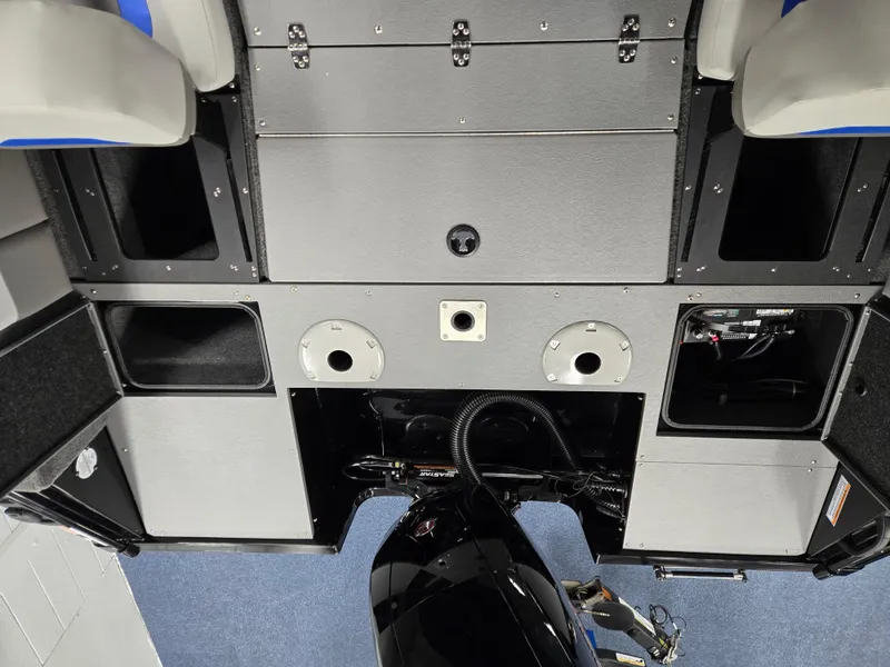 Slide: The Image of 2025 Princecraft Sport 188 boat interior with storage compartments and seating. - 13