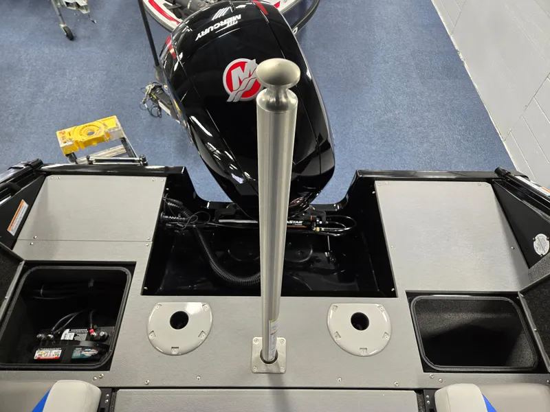 Slide: The Image of 2025 Princecraft Sport 188 boat interior with motor and storage compartments. - 14