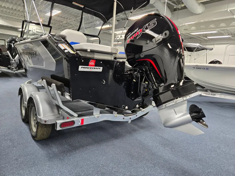 Slide: The Image of 2025 Princecraft Sport 188 boat with powerful outboard motor on a trailer. - 18