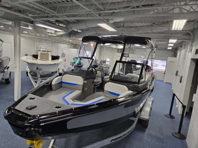 Slide: The Image of 2025 Princecraft Sport 188 boat displayed indoors, featuring sleek design and modern seating. - 4