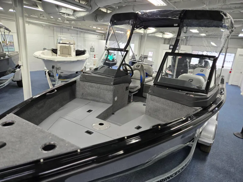 Slide: The Image of 2025 Princecraft Sport 188 boat displayed indoors, featuring a sleek design and spacious interior. - 5