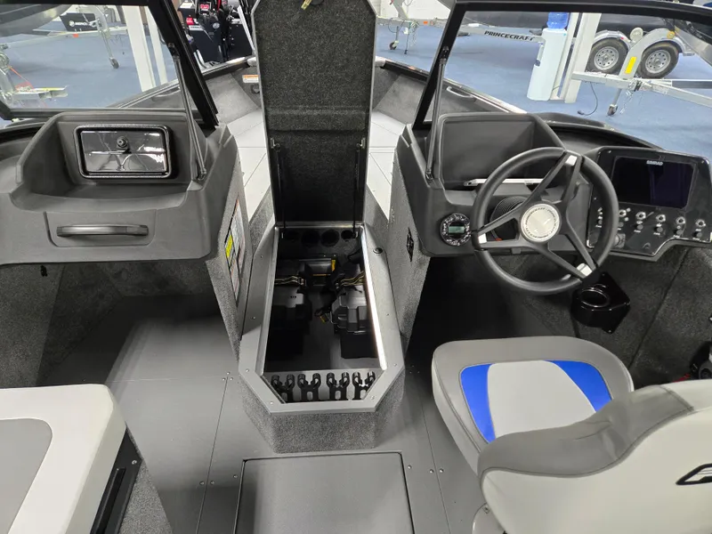 Slide: The Image of Interior view of 2025 Princecraft Sport 188 boat, featuring steering wheel and seating. - 7