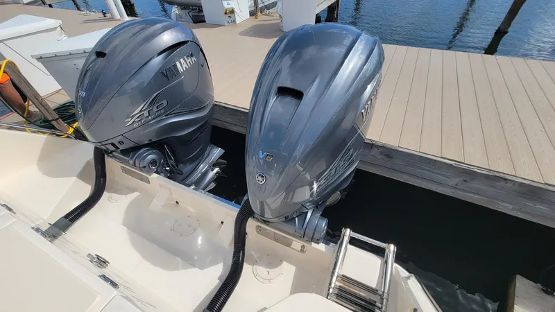 Slide: The Image of 2021 Grady-White Freedom 335 boat with twin Yamaha outboard engines at dock. - 10