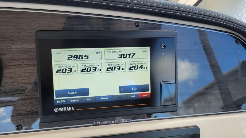 Slide: The Image of Yamaha display on 2021 Grady-White Freedom 335 boat dashboard showing engine metrics. - 16