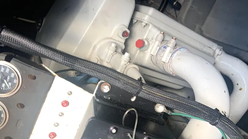 Slide: The Image of Engine compartment of a 1994 Sea Ray 500 Sundancer boat, showing gauges and components. - 10