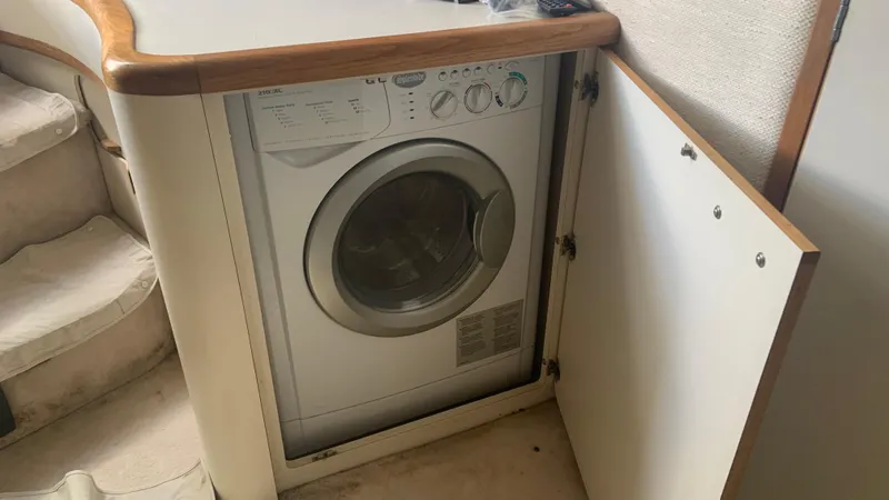 Slide: The Image of Washing machine inside 1994 Sea Ray 500 Sundancer yacht cabinet. - 18