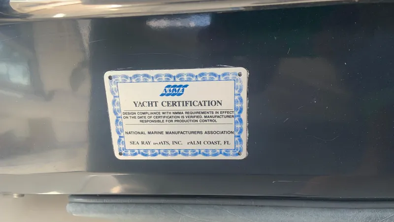 Slide: The Image of Yacht certification plaque on 1994 Sea Ray 500 Sundancer, indicating compliance with marine standards. - 6