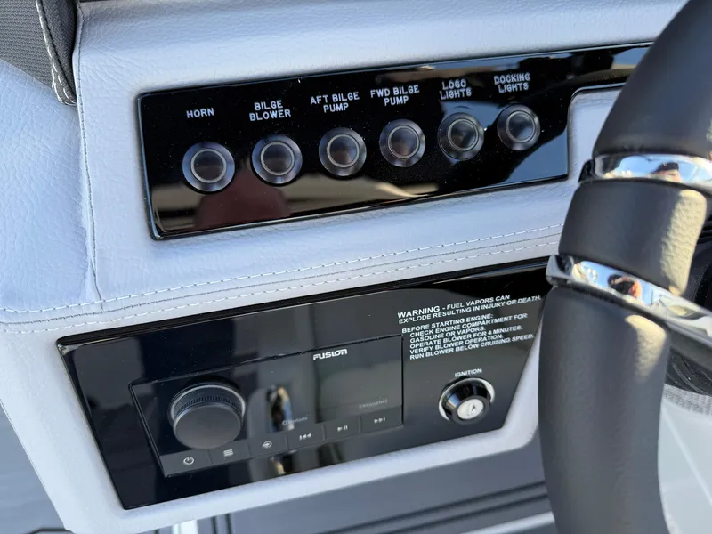 Slide: The Image of Control panel of 2025 Cobalt R6 Surf boat with various switches and controls. - 20
