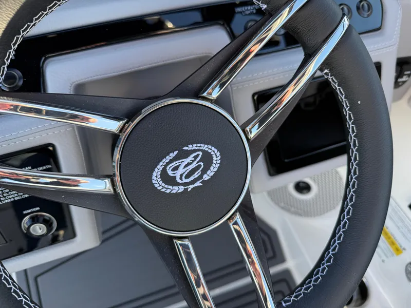 Slide: The Image of Steering wheel of 2025 Cobalt R6 Surf boat with chrome accents. - 21