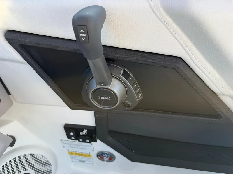 Slide: The Image of Throttle control panel of 2025 Cobalt R6 Surf boat, featuring trim adjustment. - 23
