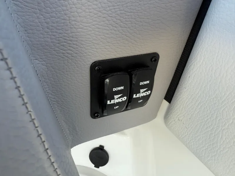 Slide: The Image of Lenco trim tab controls on 2025 Cobalt R6 Surf boat interior. - 25