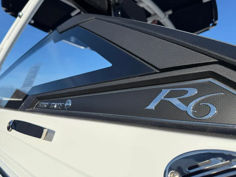 The Image of 2025 Cobalt R6 Surf boat, sleek design with modern detailing, close-up view. - 3