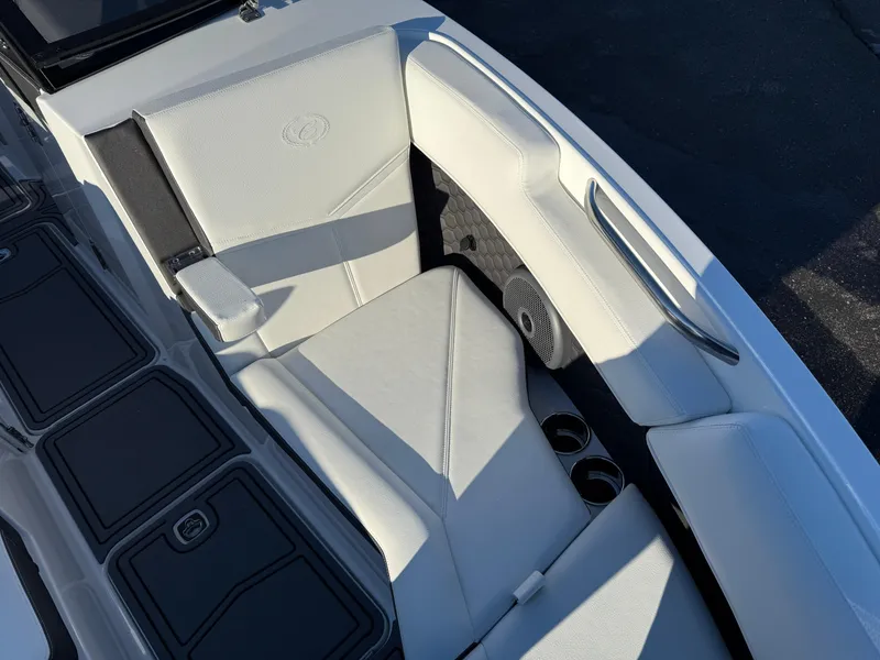 Slide: The Image of 2025 Cobalt R6 Surf boat interior with white seating and sleek design. - 30