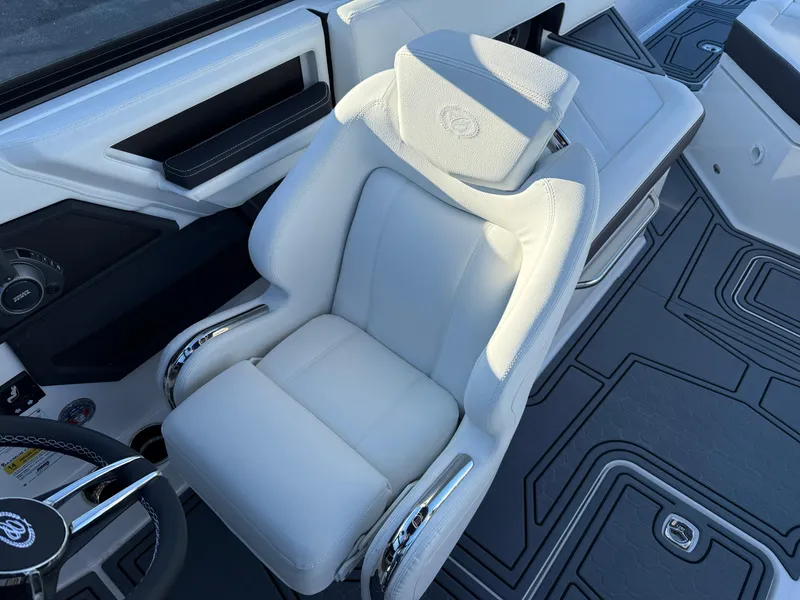 Slide: The Image of Luxury white captain's seat in 2025 Cobalt R6 Surf boat, featuring sleek design and modern controls. - 34