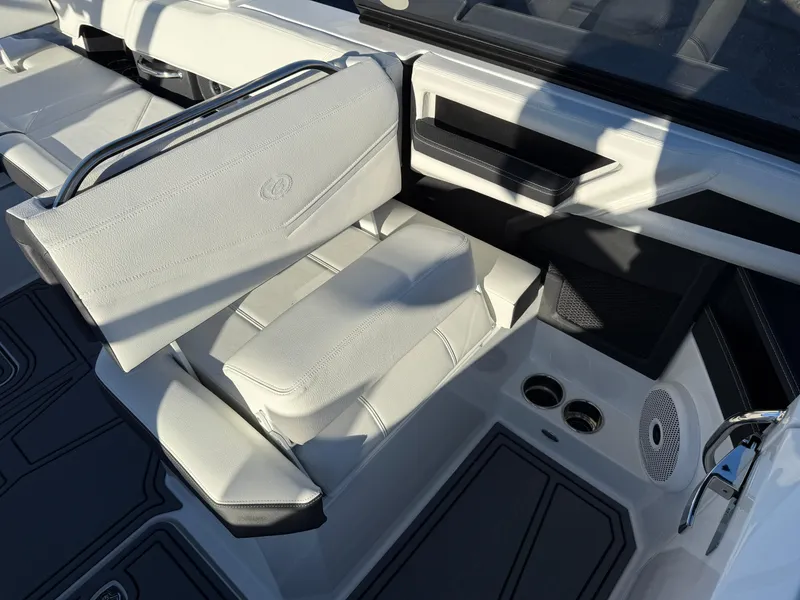 Slide: The Image of 2025 Cobalt R6 Surf boat interior with white seating and modern design. - 35