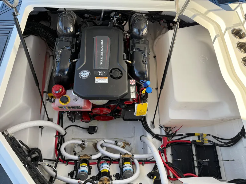 Slide: The Image of 2025 Cobalt R6 Surf engine compartment with Volvo Penta engine and organized wiring. - 43