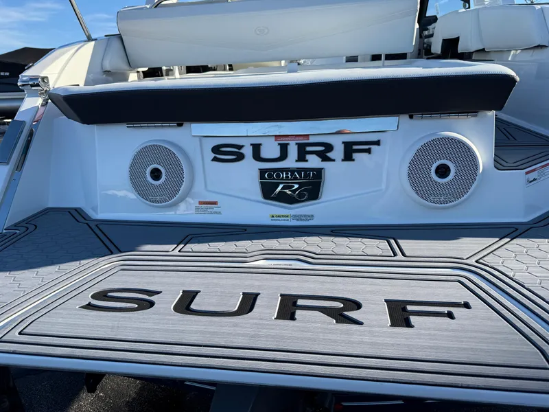 Slide: The Image of 2025 Cobalt R6 Surf boat with speakers and "Surf" branding on the deck. - 7