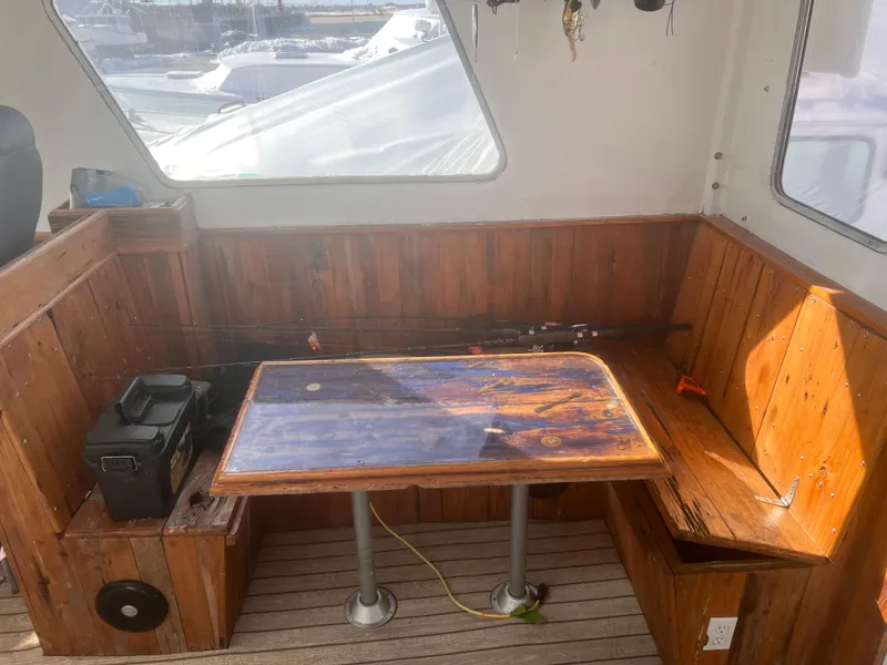 Slide: The Image of Wooden interior seating area on a 1988 Young Brothers 40 boat. - 10