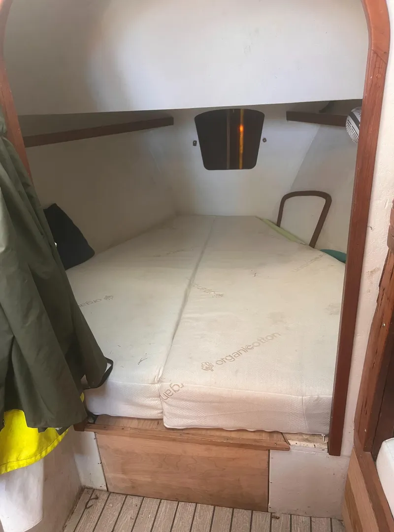 Slide: The Image of Cabin interior of 1988 Young Brothers 40 boat with a cozy sleeping area. - 15