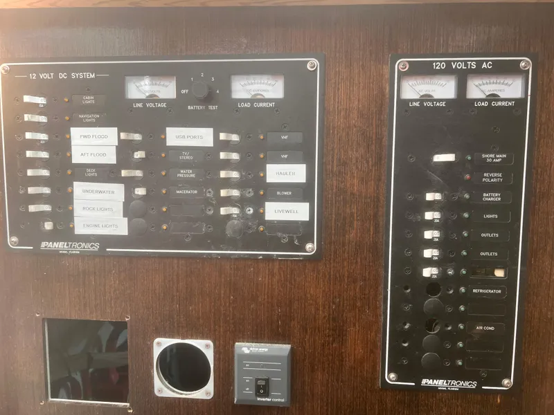 Slide: The Image of Electrical control panel on a 1988 Young Brothers 40 boat, featuring 12V DC and 120V AC systems. - 20