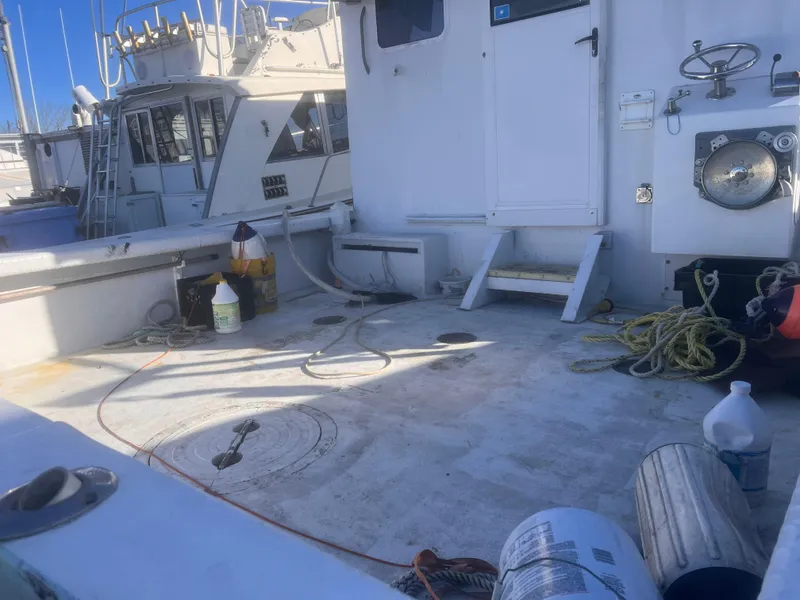 Slide: The Image of Deck of 1988 Young Brothers 40 boat with ropes and equipment. - 8