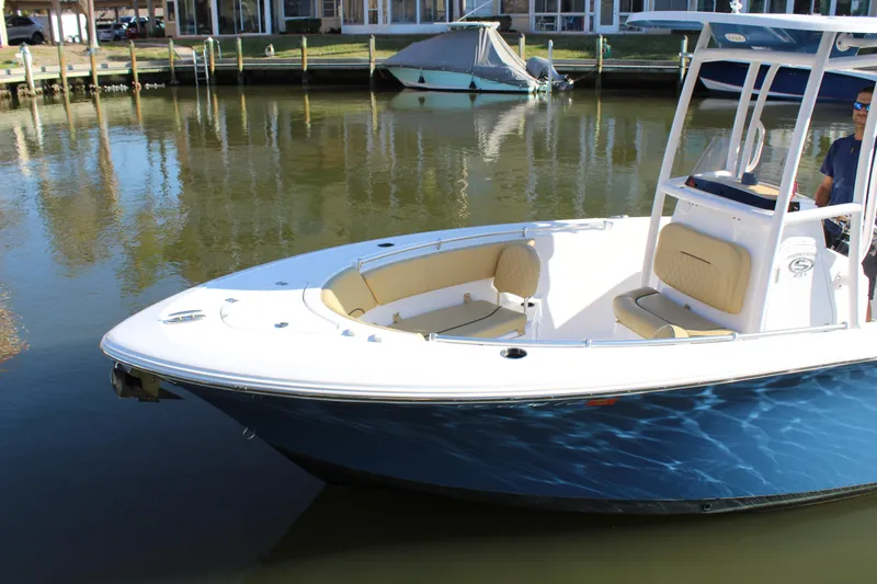Slide: The Image of 2023 Sportsman Heritage 231 Center Console boat on calm water. - 15