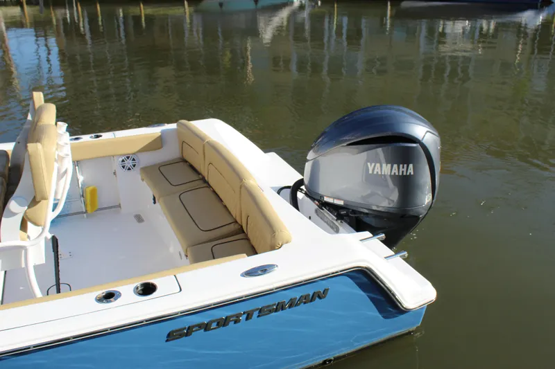 Slide: The Image of 2023 Sportsman Heritage 231 Center Console boat with Yamaha engine on calm water. - 17