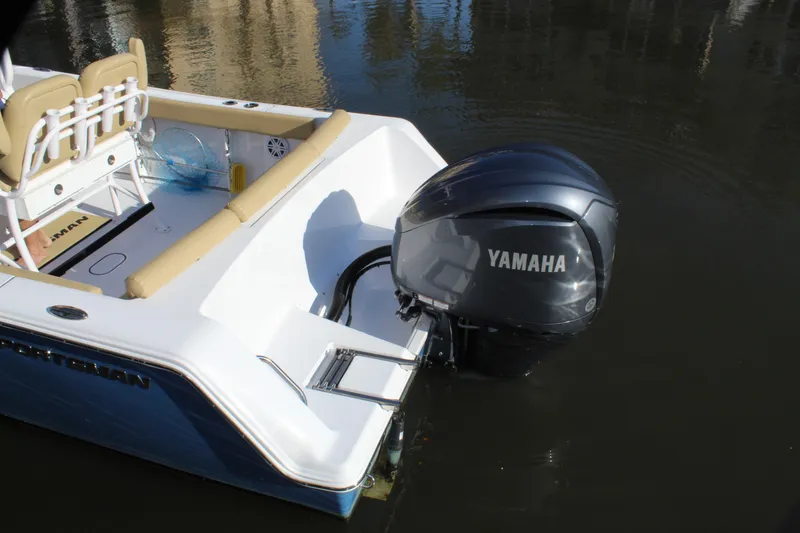 Slide: The Image of 2023 Sportsman Heritage 231 Center Console with Yamaha outboard engine in water. - 18