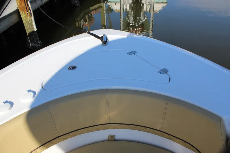 Slide: The Image of 2023 Sportsman Heritage 231 Center Console boat bow with seating and storage. - 22