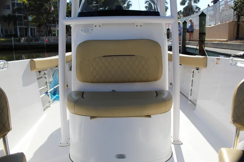 Slide: The Image of 2023 Sportsman Heritage 231 Center Console boat interior with tan seating. - 24