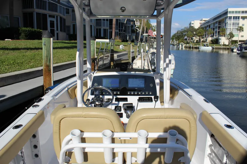 Slide: The Image of 2023 Sportsman Heritage 231 Center Console boat interior at a dockside canal. - 35
