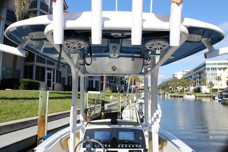 Slide: The Image of 2023 Sportsman Heritage 231 Center Console boat docked by a canal. - 39